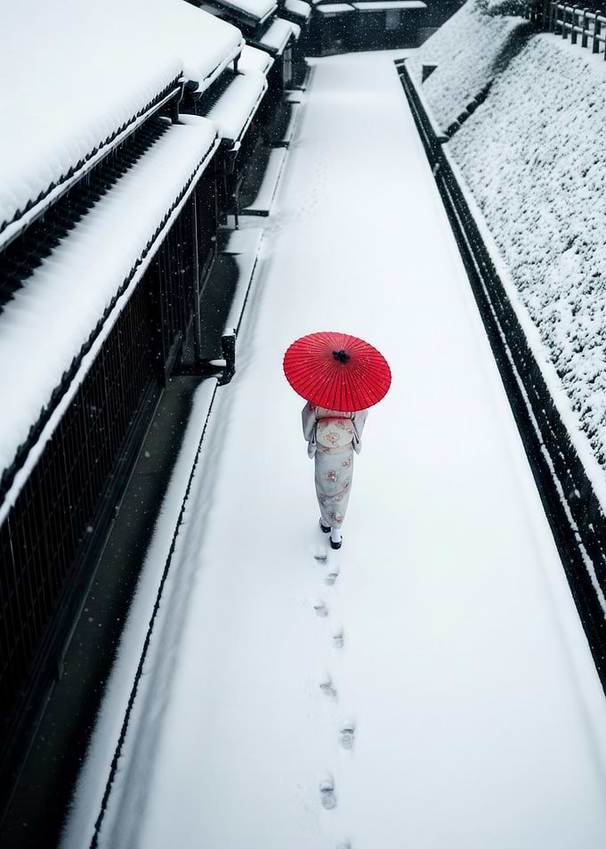 Japanese Woman in Kimono With Red Umbrella Walking Through Snowy Path