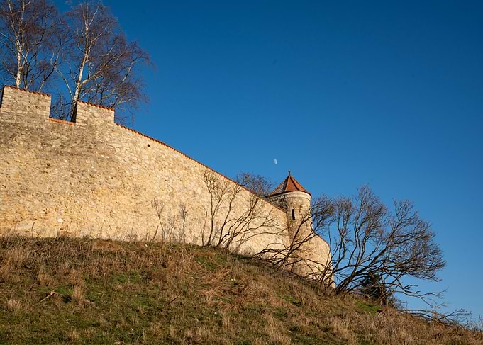 Stone Wall and Tower Under Blue Sky