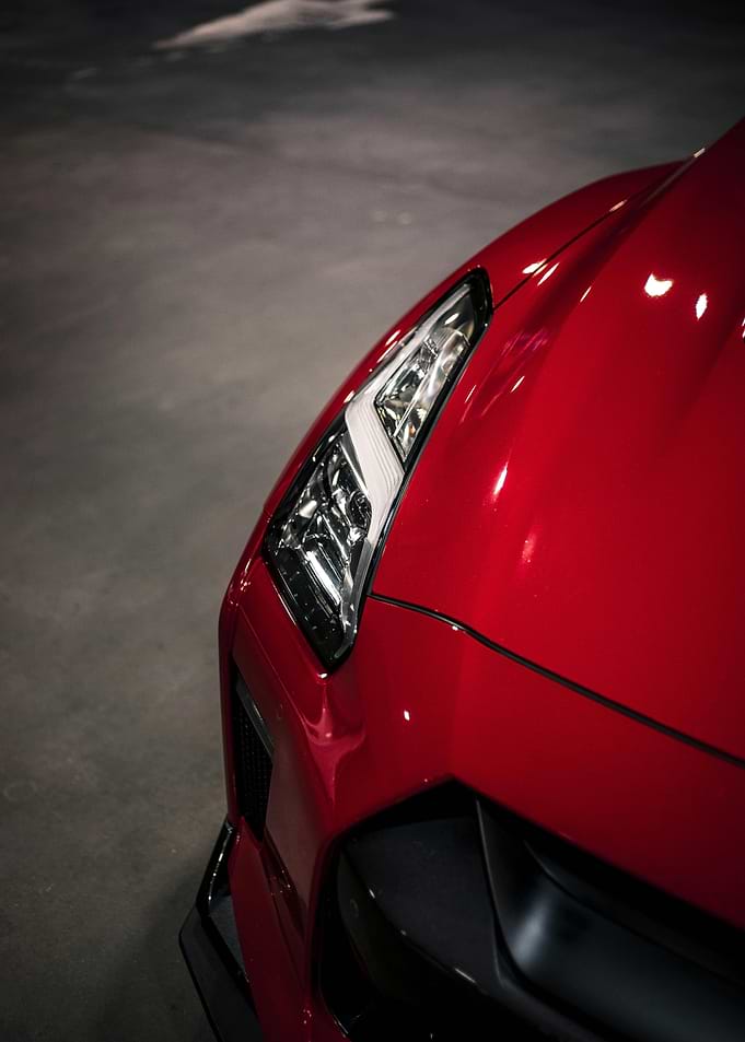 Red Car Headlight Close-Up