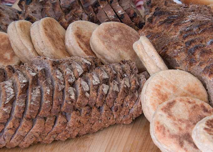 Assorted Breads on Wooden Surface