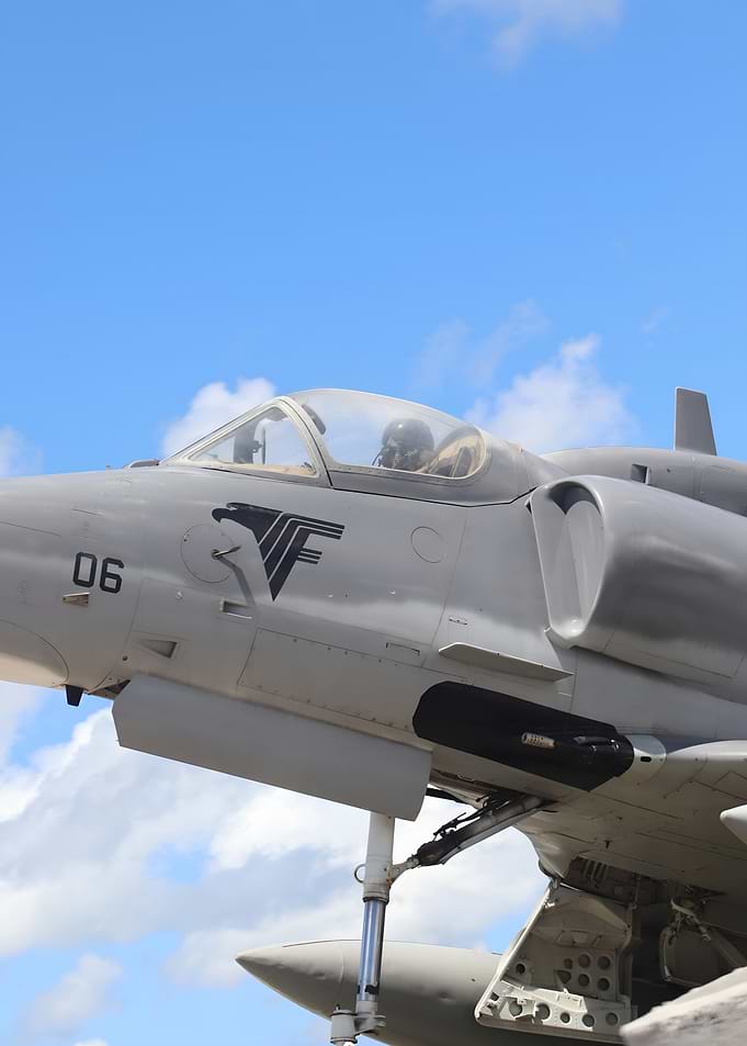 Gray Military Jet Against Blue Sky