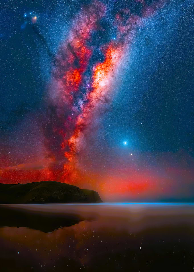 Milky Way over coastal landscape