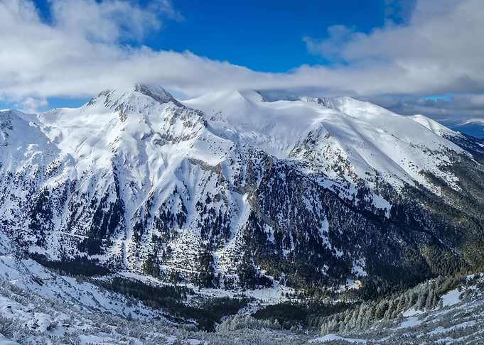 Snowy Mountain Range Under Blue Sky
