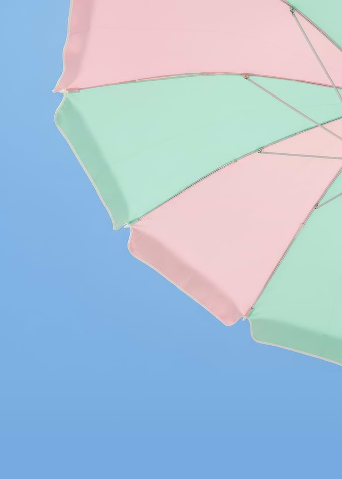 Summer Pastel Beach Umbrella Against Blue Sky