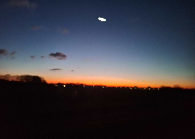 Sunset over a dark landscape