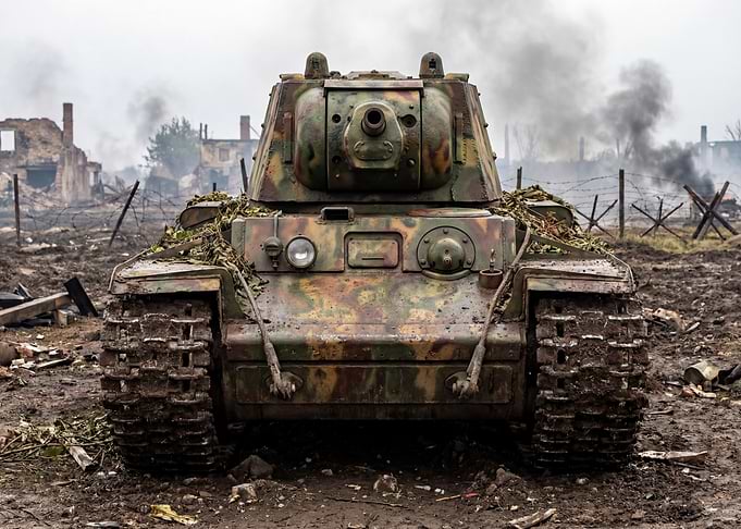 Camouflaged Tank in War-Torn Landscape