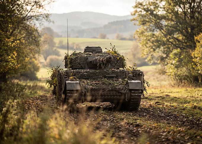 Camouflaged Tank in Autumn Landscape