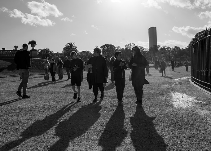 People walking in a park, black and white