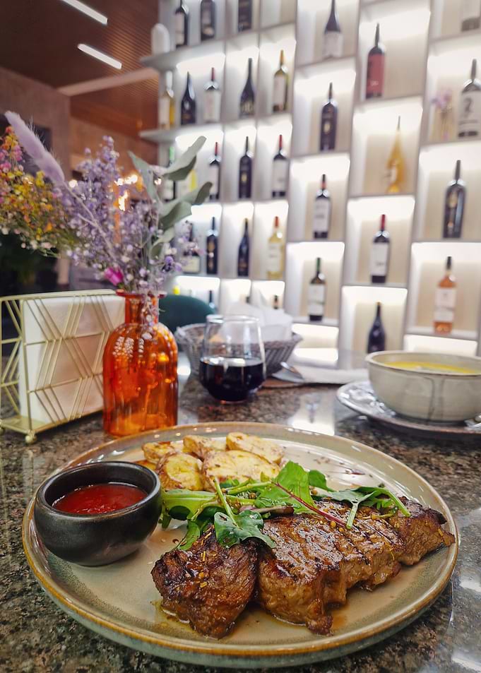 Steak Dinner with Wine and Flowers