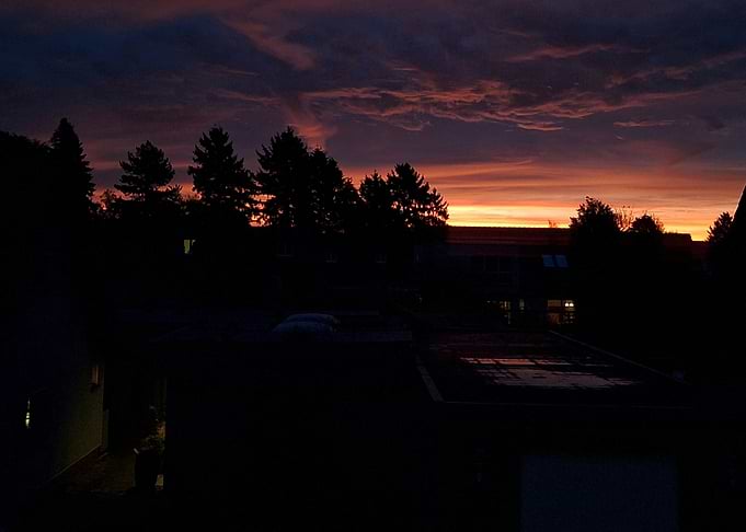 Dramatic Sunset Over Dark Silhouettes