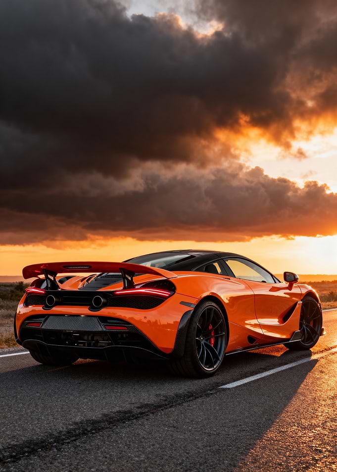 Orange McLaren on Road at Sunset