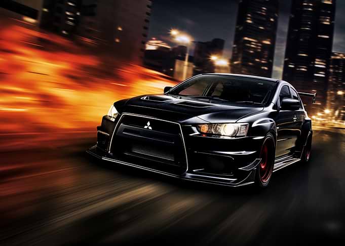 Black sports car speeding