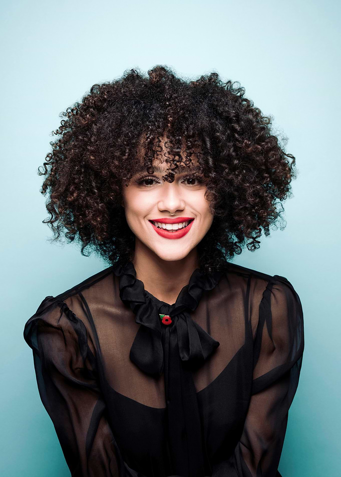Nathalie Emmanuel Portrait with Poppy Pin