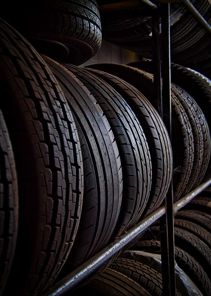 Stacked Car Tires on Metal Shelves