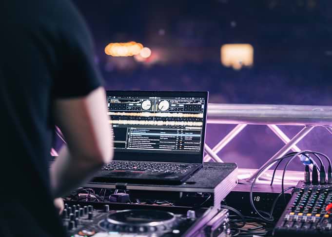 DJ setup with laptop and mixer