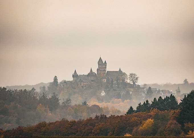 Magical Medieval Castle on Hill in Fog
