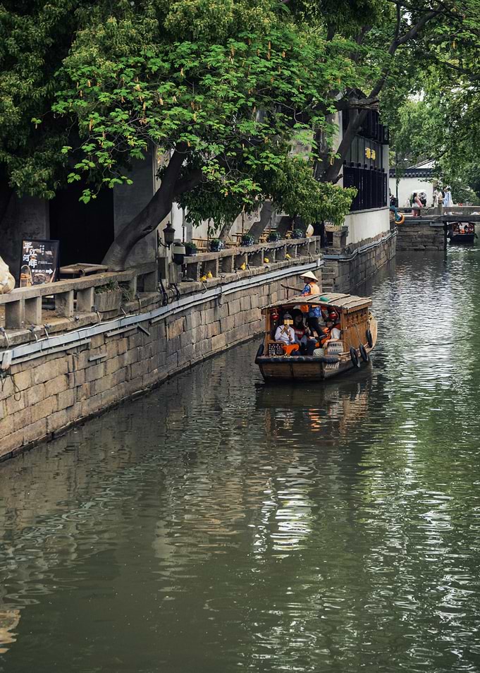 Canal boat tour in Asian city