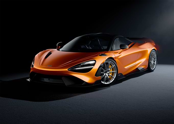 Orange McLaren sports car studio shot