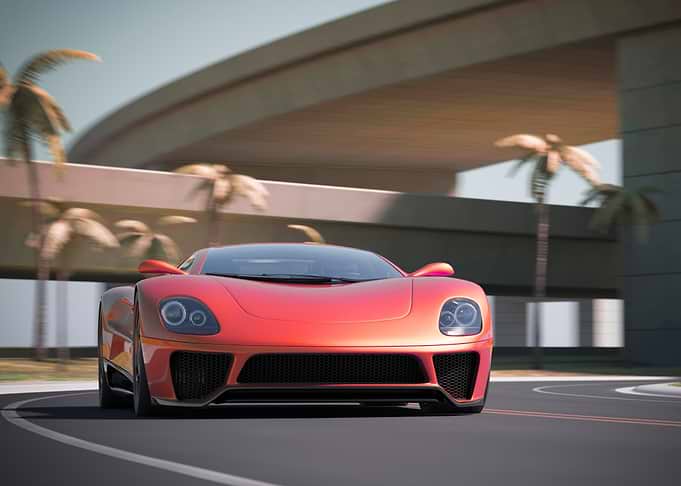 Red Sports Car on Coastal Road