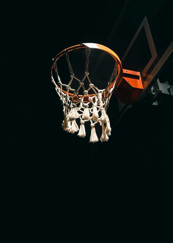 Basketball hoop against a dark background
