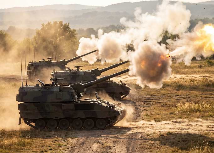 Military Tanks Firing on Battlefield