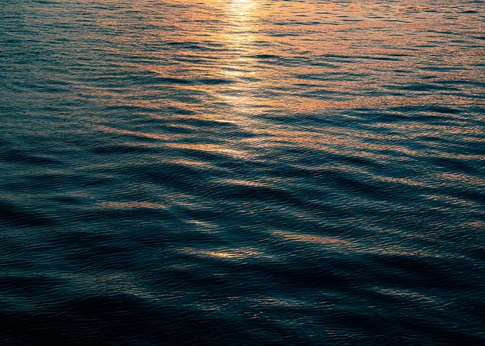 Calm Ocean Water at Sunset