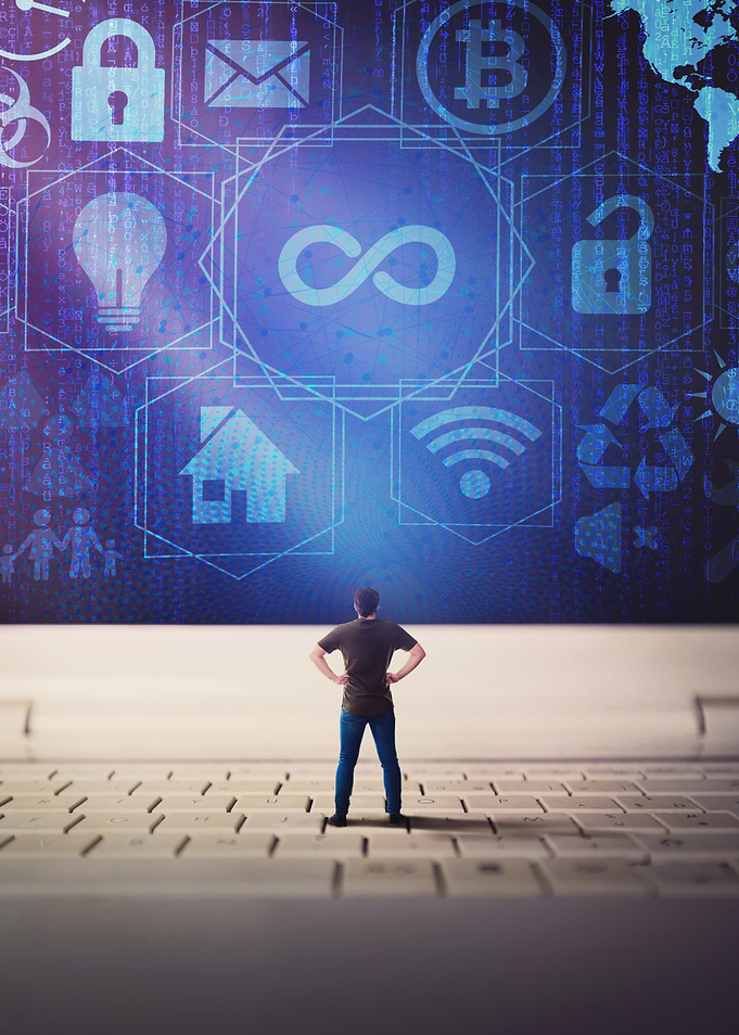 Man on Keyboard with Digital Icons