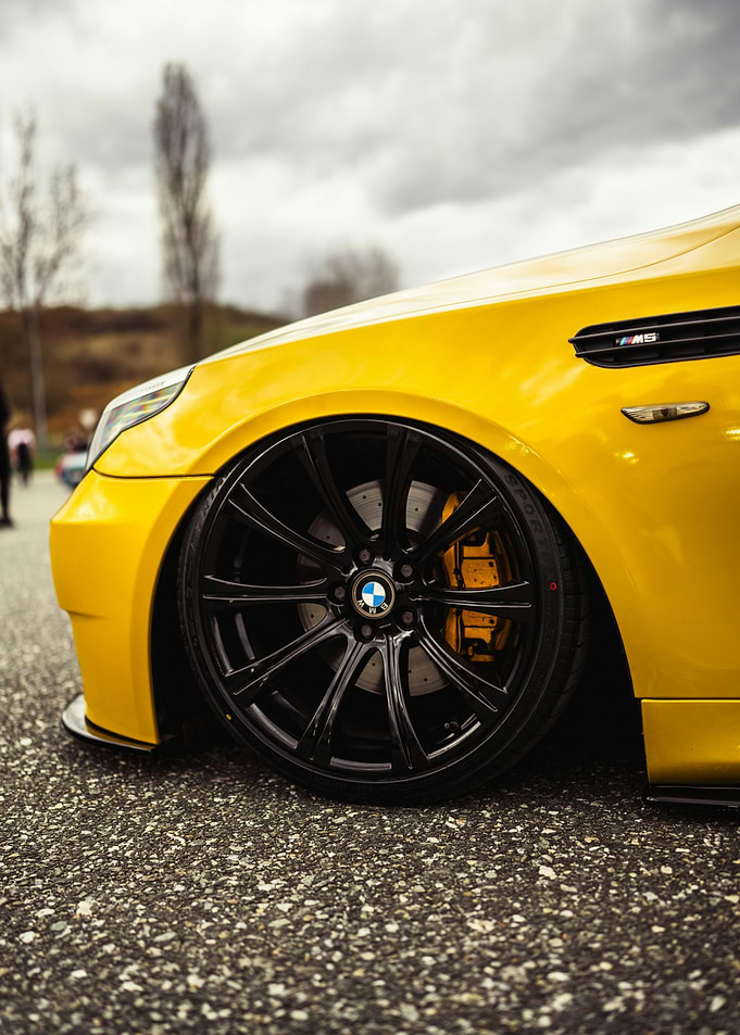 Yellow BMW M5 with Black Rims