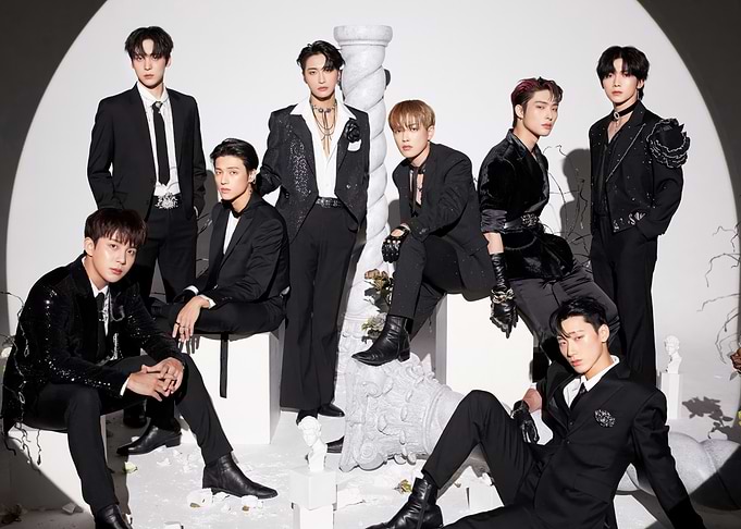 ATEEZ group photo in black suits