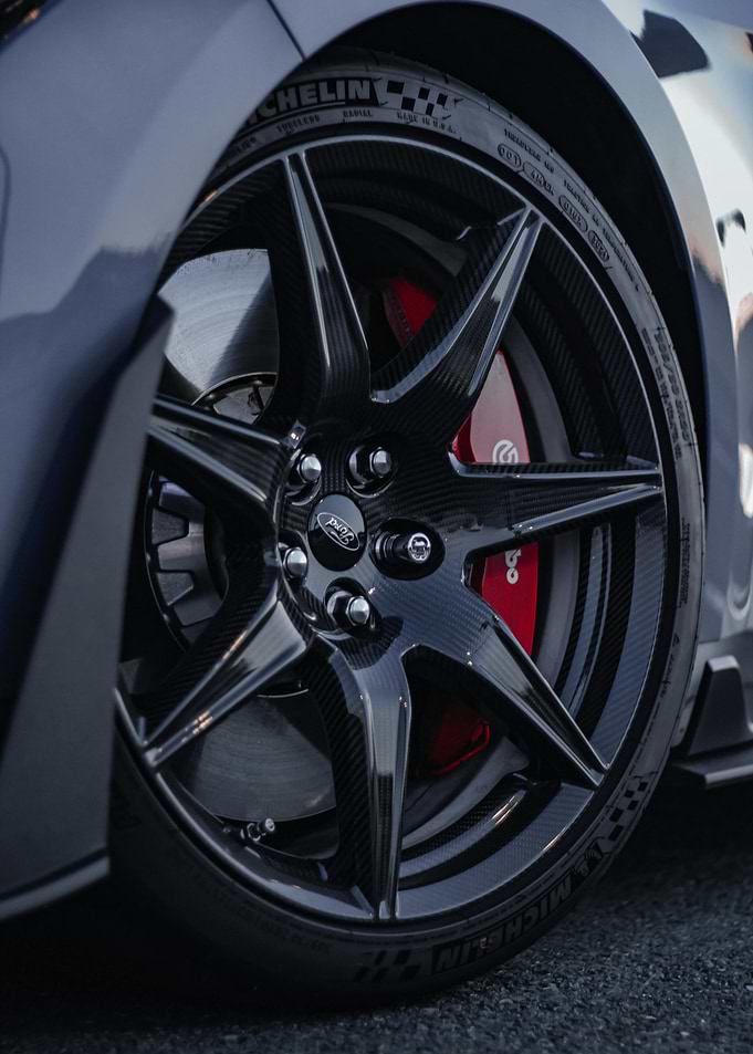 Car wheel with red brake caliper