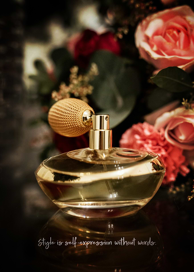 Elegant Perfume with Floral Backdrop Poster