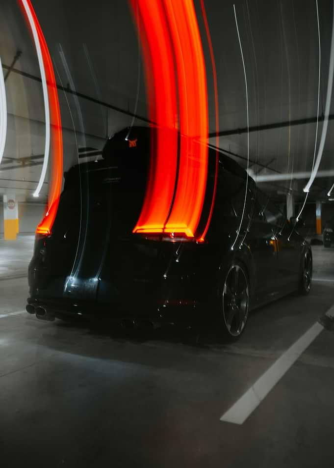 Black car with light trails