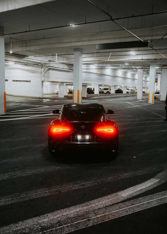 Black car in parking garage