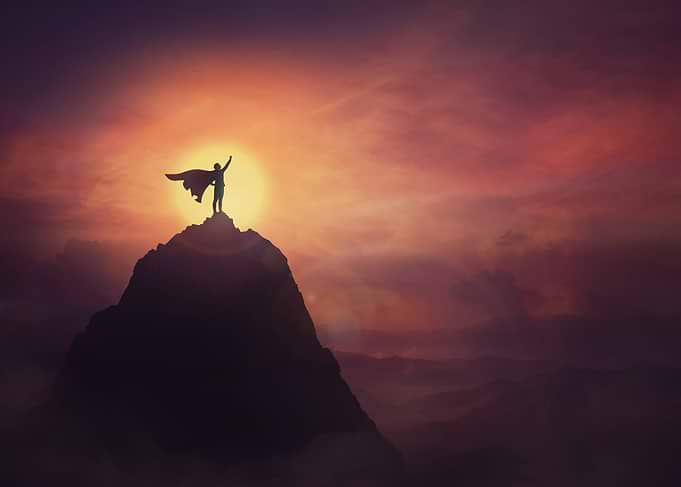 Silhouette of a Hero on Mountain Peak