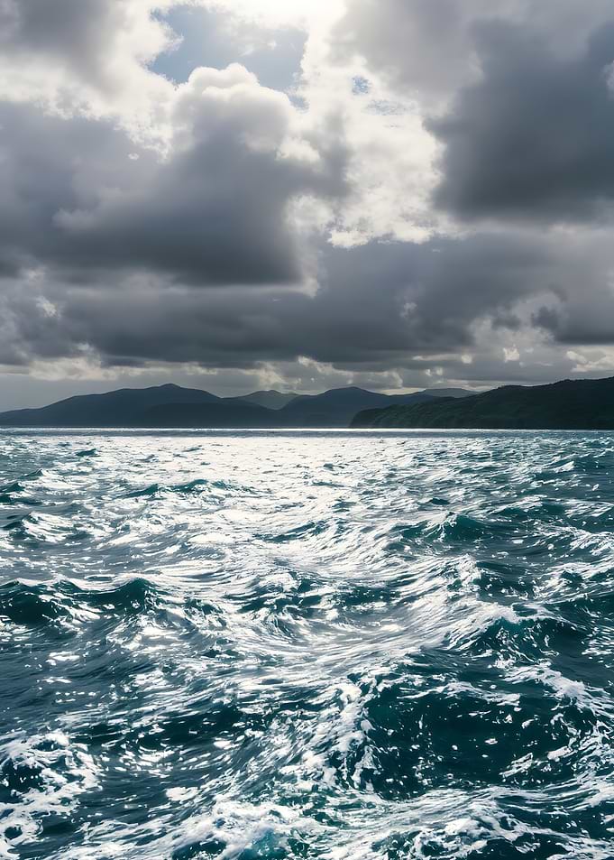 Ocean waves under a cloudy sky