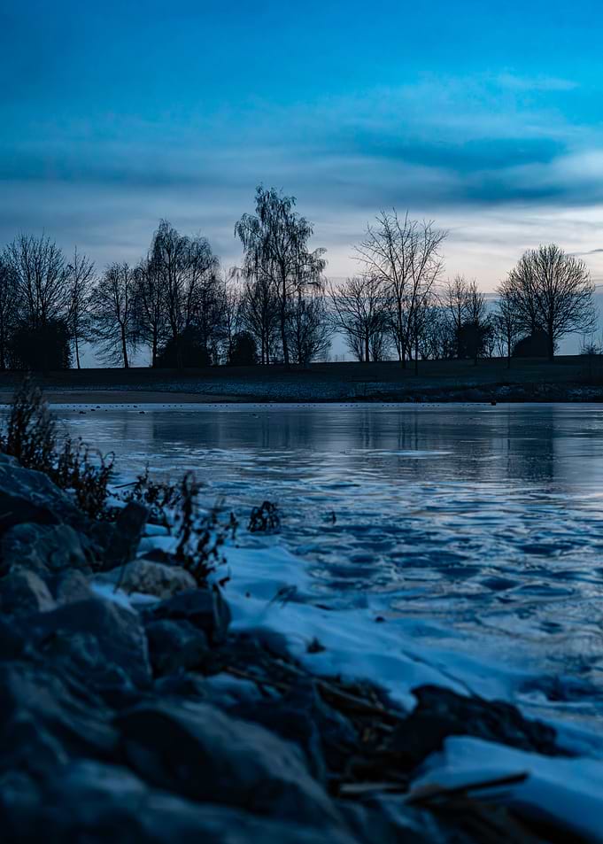 Icy Riverbank at Dusk