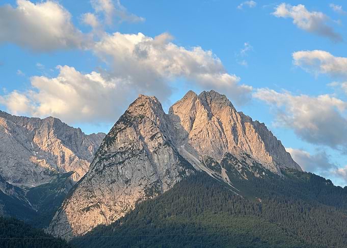 Mountain Peaks Under a Cloudy Sky