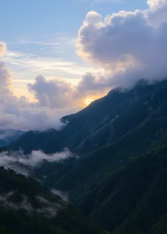 Mountain Peaks Emerging Through Clouds