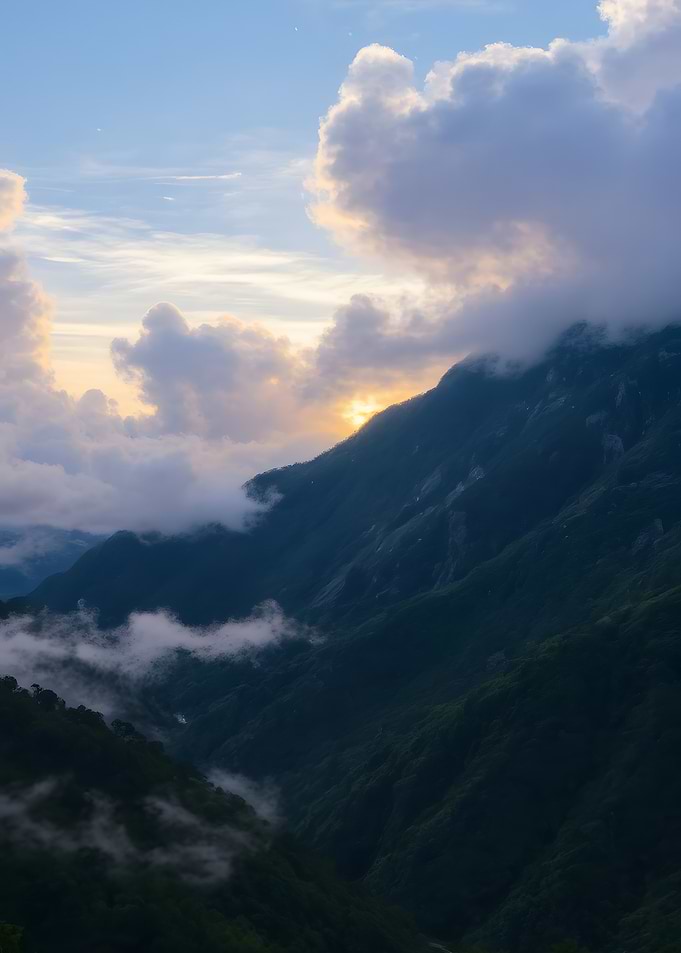 Mountain Peaks Emerging Through Clouds
