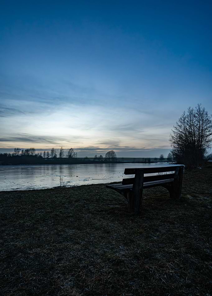 Bench by Frozen Lake at Dusk