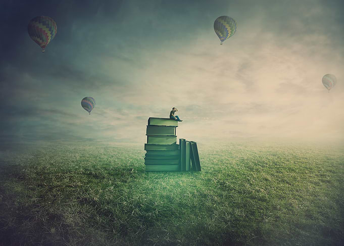 Boy on Books with Hot Air Balloons