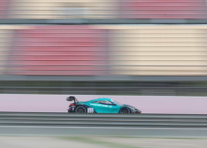 McLaren Race Car Speeding on Track