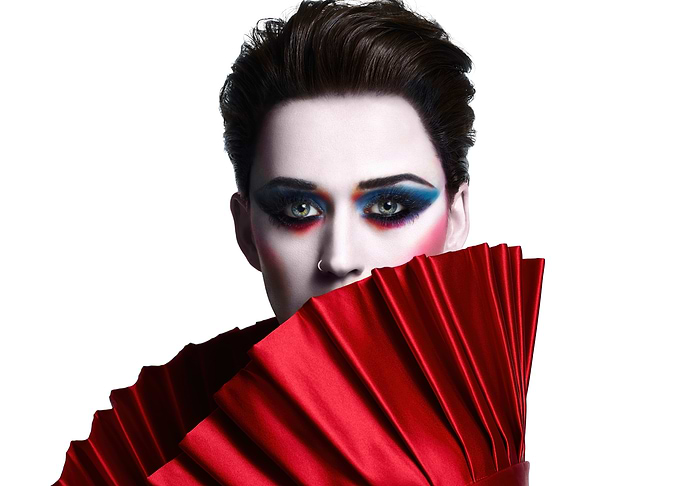 katy perry with dramatic makeup and red fan