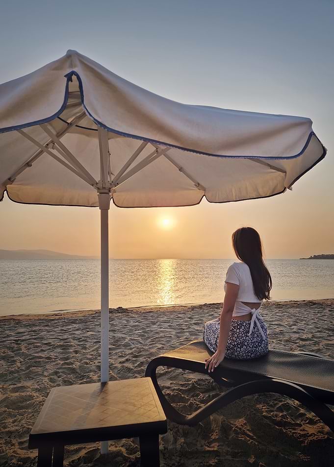 Woman on beach at sunset