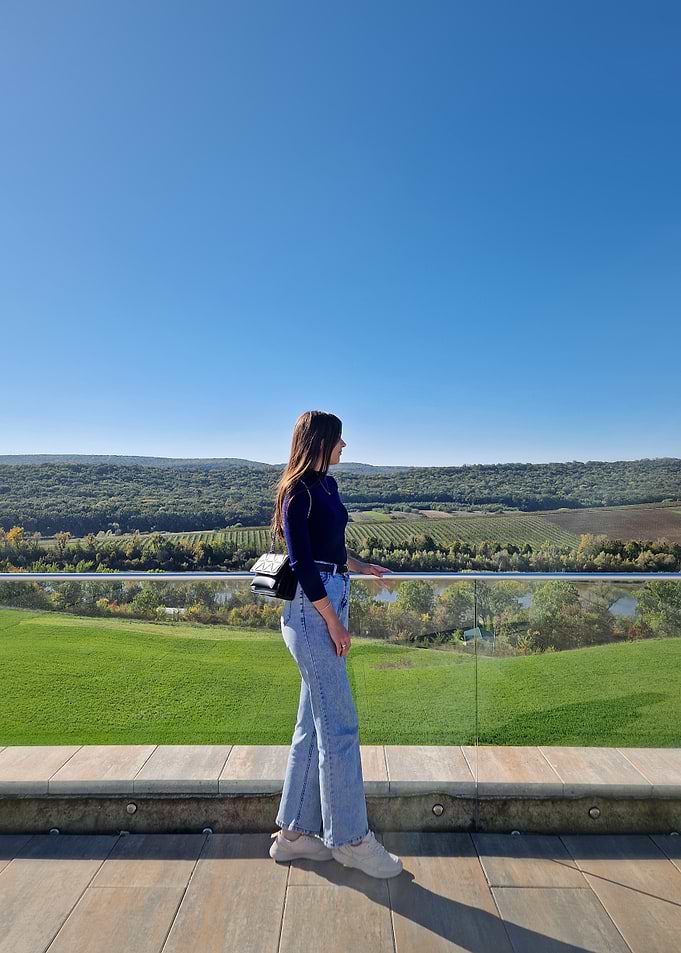 Woman overlooking landscape on sunny day