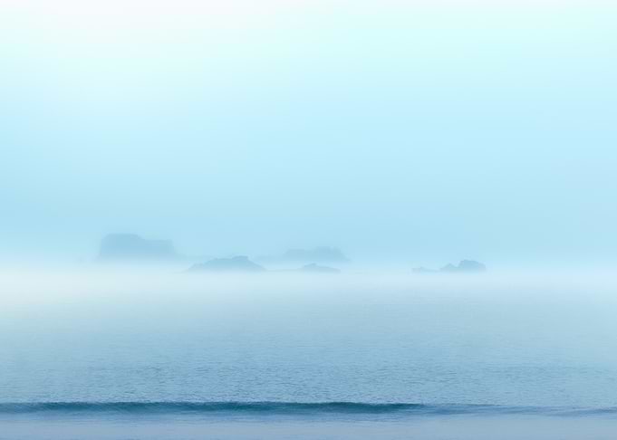 Misty seascape with rocks