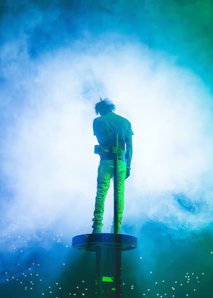 Man on Stage in Blue Light