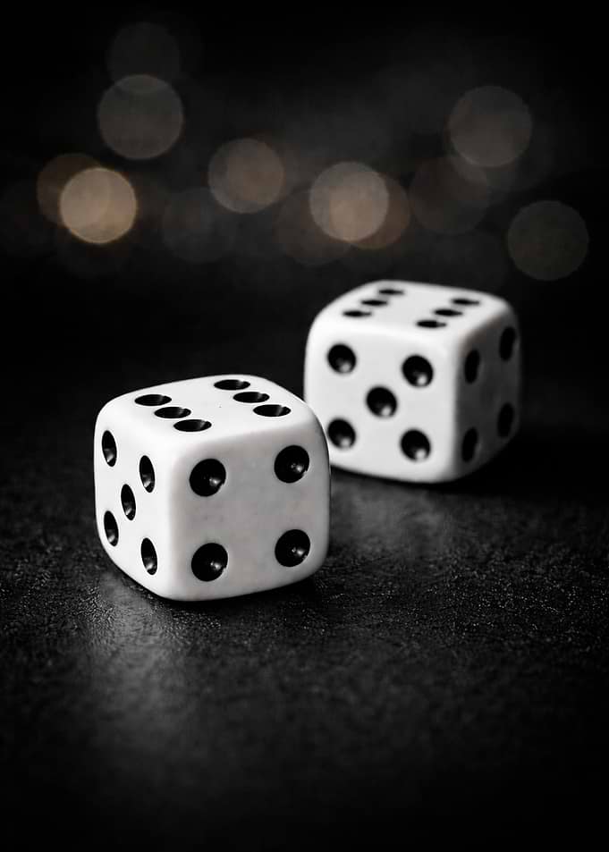 Double Six Dice on a Dark Surface