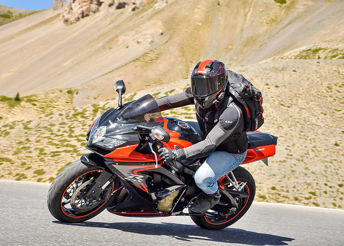 Motorcycle rider on mountain road