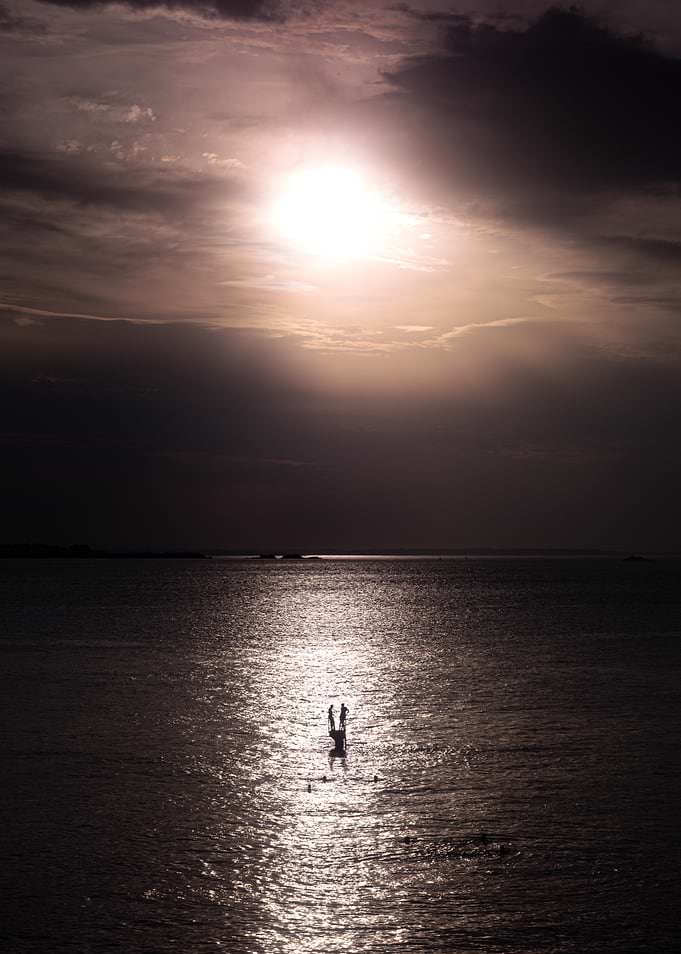 Silhouettes on a Sunlit Ocean